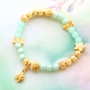 Sieraden in mintgroene tinten van Polaris Elements kralen met gouden details