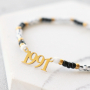 Deze sieraden kun je maken met de nieuwe stainless steel jaartal tussenstukken: