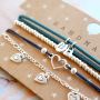 Deze oorbellen, armbanden en ketting maak je eenvoudig zelf met DQ metalen bedels: