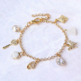 Trendy oorbellen en armbanden met zirkonia bedels en tussenstukken:
