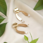 Oorbellen inspiratie met gouden en zilveren bedels en tussenstukken