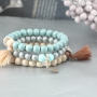 Deze armbandjes en oorbellen in zachte kleuren van ronde glaskralen zijn echt super cute!